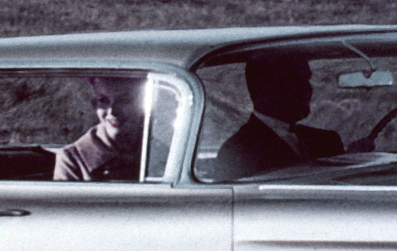 A couple enjoying a drive in their new 1959 Impala Sport Sedan